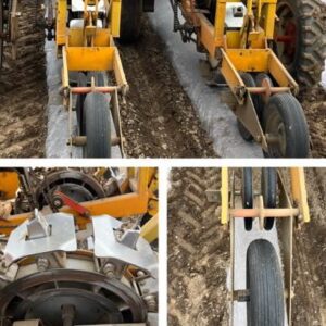 Agricultural machinery with wheels on soil.